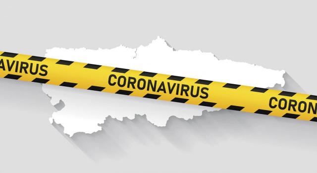El Pleno del TC admite a trámite el recurso de inconstitucionalidad la nueva deducción asturiana en el IRPF para subvenciones y/o ayudas de la covid-19. Imagen del territorio de Asturias tachado con la palabra Coronavirus