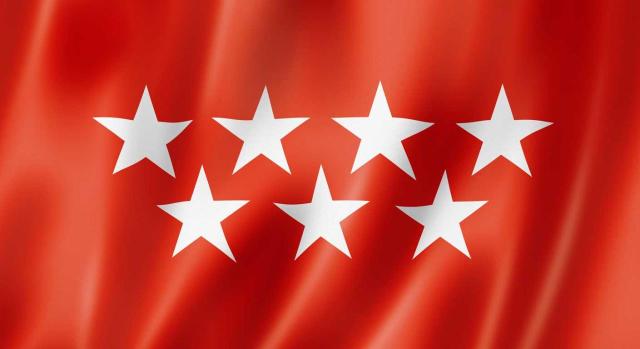 La Comunidad de Madrid amplía el convenio con los Registradores de la Propiedad para facilitar la tramitación y liquidación de impuestos. Imagen de la bandera de la Comunidad de Madrid