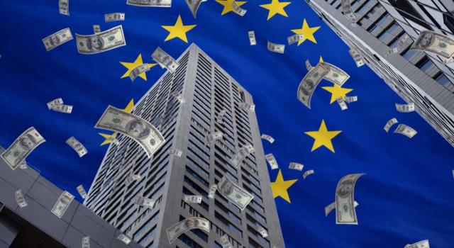 Requisitos de prueba para la denegación de exenciones en el IRNR por beneficiario efectivo y abuso de derecho. Imagen de una ciudad en la que sobre vuelan dolares