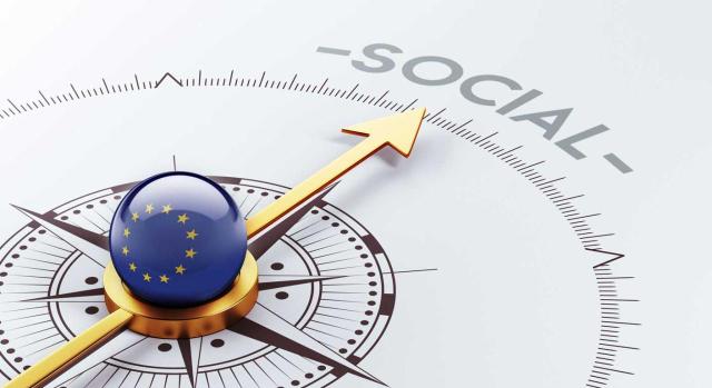 Últimas consultas de la DGT sobre el Impuesto de Actividades económicas referidas a la clasificación en las tarifas de distintas actividades, y el tratamiento de los cursos del SEPE o financiados por Fondo Social Europeo. Imagen de una brújula con el centro de la bola con la bandera de la UE señalando a la palabra SOCIAL