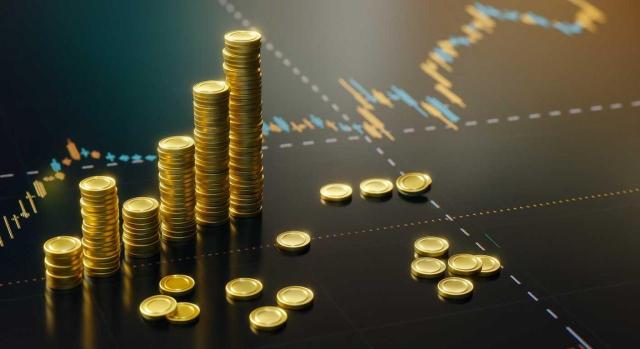 La DGT sobre la inclusión del trust en el ISD La DGT también se pronuncia sobre la inclusión de un “trust” extranjero en el ISD en caso de fallecimiento del beneficiario. Imagen de fichas doradas imitando a monedas en montoncitos sobre un fondo de gráficos