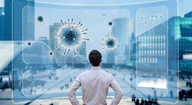 El TS matiza: se puede dejar sin efecto una liquidación firme del IAE y obtener devolución de ingresos indebidos al margen de los pos especiales de revisión en el contexto de una crisis sanitaria. Imagen de un hombre de espaldas revisando una pantalla virtual varios gráficos