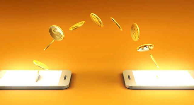 ISD reducción del 95% para participaciones en entidades: reinversión en otros bienes ISD reducción del 95% para participaciones en entidades: posibilidad de enajenar las participaciones y reinvertir en otros bienes o activos. Imagen de dos móviles en los que salen por el aire monedas que van de un móvil a otro