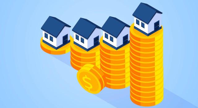 EL TS se pronuncia sobre el porcentaje de amortización de un inmueble a efectos de determinar el valor de adquisición de inmueble en el IRPF. Imagen de gráfico hecho con monedas y en la cima unas casitas