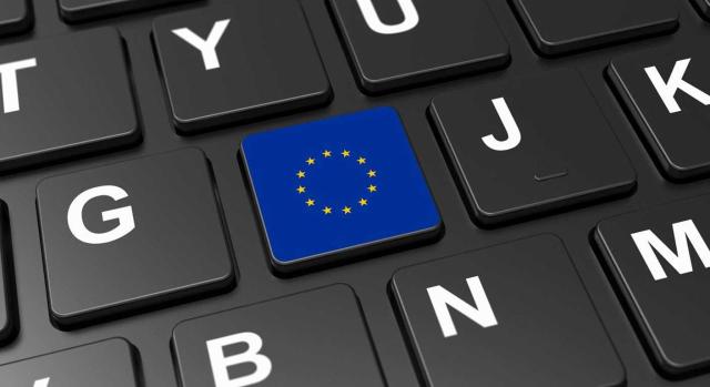 Proyecto de Ley de modificación de la Ley del IVA Proyecto de Ley de modificación de la Ley del IVA para transponer la Directiva ViDA. Imagen de un teclado de ordenador y en una tecla la bandera de la UE